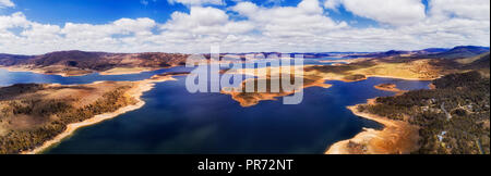 Jindabyne lake in Snowy mountains catchment area on Snowy river seen from above in wide aerial panorama around Waste point towards Jindabyne town and  Stock Photo