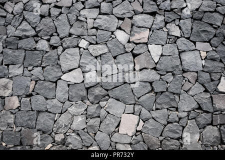 natural stone wall background. texture of a stone wall - Stock Photo
