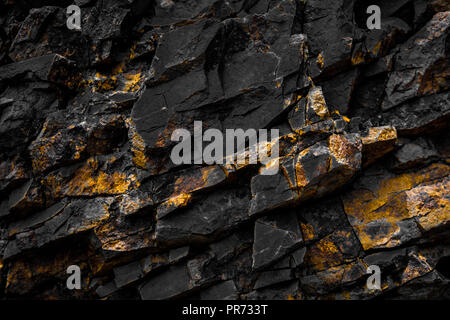 black rock background with golden / yellow color - Stock Photo