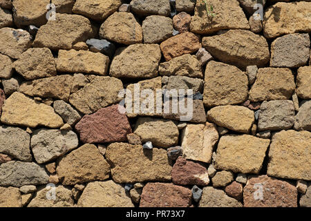 natural stone wall background. texture of a stone wall - Stock Photo