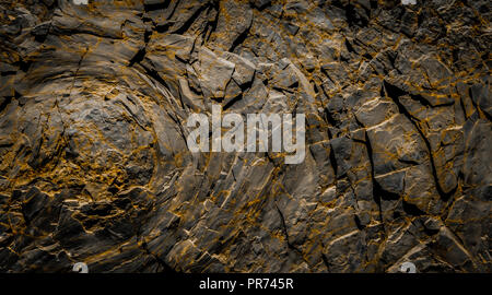 dark rocks  background - black rock stone texture Stock Photo