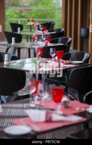 table setting at modern tropical restaurant Stock Photo