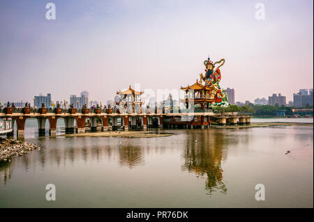 Lotus pond view and statue of taoist god Xuan Tian Shang Di in Kaohsiung Taiwan HDR Stock Photo