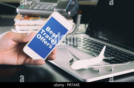 Best travel offer on smartphone for business man Stock Photo