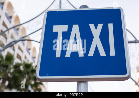 Blue Taxi Sign in the city centre Stock Photo