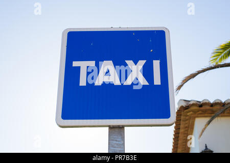 Blue Taxi Sign in the city centre Stock Photo