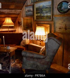Classical style Armchair sofa couch in vintage room with desk lamp and paintings Stock Photo