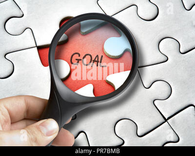 Magnifying glass on goal missing tile of the puzzle Stock Photo