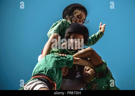 Torredembarra, Spain. 30 September, 2018:  The 'Castellers del Riberal' build a human tower during the first day of the 27th Tarragona Human Tower Competition in Torredembarra. The competition takes place every other year and features the main 'Castellers' teams (colles) of Catalonia during a three day event organized by the Tarragona City Hall Credit: Matthias Oesterle/Alamy Live News Stock Photo