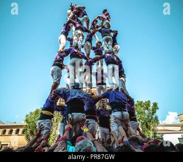 Torredembarra, Spain. 30 September, 2018:  The 'Castellers de Figueres' build a human tower during the first day of the 27th Tarragona Human Tower Competition in Torredembarra. The competition takes place every other year and features the main 'Castellers' teams (colles) of Catalonia during a three day event organized by the Tarragona City Hall Credit: Matthias Oesterle/Alamy Live News Stock Photo