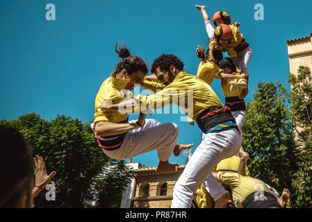 Torredembarra, Spain. 30 September, 2018:  A human tower of the 'Castellers de Castelldefels' collapses during the first day of the 27th Tarragona Human Tower Competition in Torredembarra. The competition takes place every other year and features the main 'Castellers' teams (colles) of Catalonia during a three day event organized by the Tarragona City Hall Credit: Matthias Oesterle/Alamy Live News Stock Photo