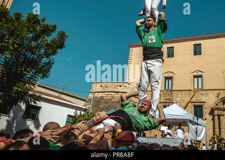 Torredembarra, Spain. 30 September, 2018:  A human pillar of the 'Castellers del Riberal' collapses during the first day of the 27th Tarragona Human Tower Competition in Torredembarra. The competition takes place every other year and features the main 'Castellers' teams (colles) of Catalonia during a three day event organized by the Tarragona City Hall Credit: Matthias Oesterle/Alamy Live News Stock Photo
