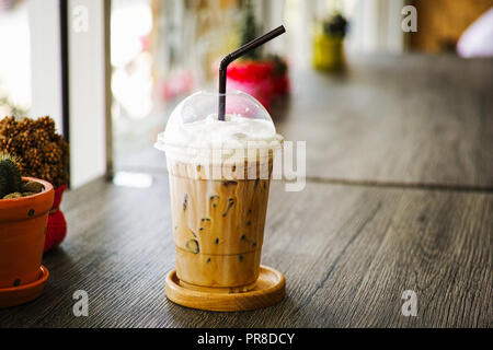 Plastic cup of cold coffee on white background Stock Photo - Alamy