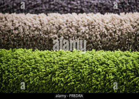 set of multi-colored rugs for home at store Stock Photo