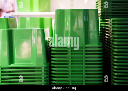 folded green plastic containers at store Stock Photo