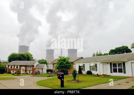 2007 - Coal powered company cooling towers behind a residential neighborhood Stock Photo