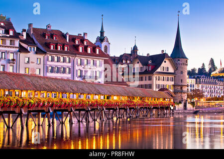 Luzern Chapel Bridge and waterfront landmarks dawn view, town in central Switzerland Stock Photo