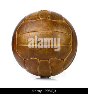 vintage lace up leather football soccer ball on site background Stock Photo