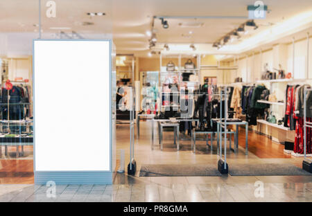 Clothes shop entrance with empty billboard mockup to place text, logo or advertisement Stock Photo