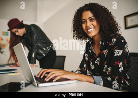 businesswoman working on laptop computer in office sitting in the conference room. business colleagues working together in office. Stock Photo