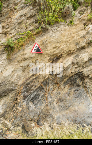 Harbour scenes around Newquay, Cornwall. Beware of falling rocks warning sign at Newquay cliffs. Stock Photo