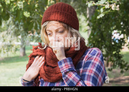 Young woman wearing woolen cap and scarf outdoor