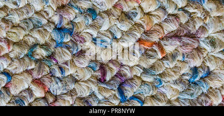 Soft wool floor fabric covering with different colors in macro close up background texture Stock Photo