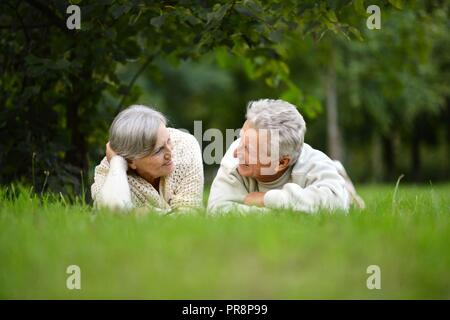 Portrait of happy elderly couple in nature Stock Photo