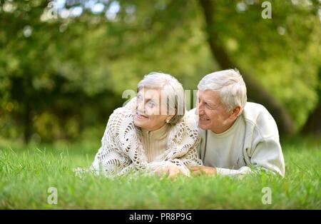 Portrait of happy elderly couple in nature Stock Photo