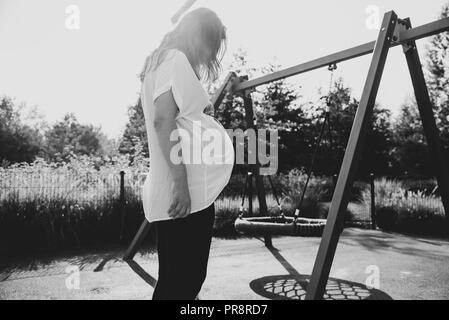 lonely pregnant woman on the playground Stock Photo - Alamy