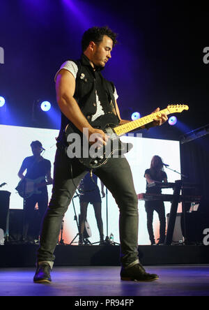 Kevin Jonas with The Jonas Brothers performs at the Cruzan Amphitheatre in West Palm Beach, Florida on August 2, 2013. Stock Photo