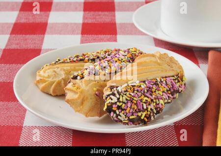 Gourmet shortbread cookies dipped in chocolate and coverd in candy sprinkles Stock Photo