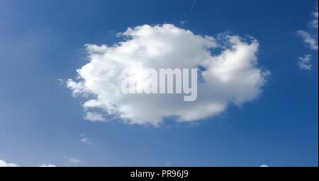 Beautiful clouds against a blue sky background. Cloudscape sky. Blue sky with cloudy weather, nature cloud. White clouds, blue sky and sun. Stock Photo