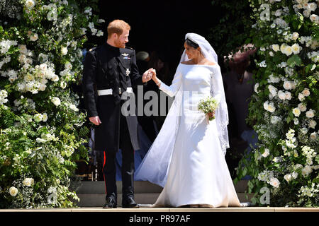 File photo dated 19/05/2018 of Prince Harry and Meghan Markle leaving at St. George's Chapel in Windsor Castle after their wedding ceremony as Princess Eugenie and fiance Jack Brooksbank are following in the footsteps of the Duke and Duchess of Sussex, Earl of Wessex and the Queen's eldest grandson Peter Phillips by marrying in St George's Chapel. Stock Photo