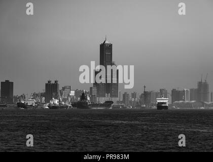 Black and white view of Kaohsiung port and skyline in background