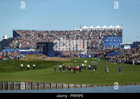 Players make the way down the first hole during the Singles match on day three of the Ryder Cup at Le Golf National, Saint-Quentin-en-Yvelines, Paris. Stock Photo