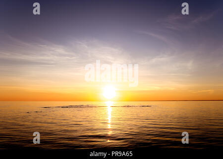 Sunset sun over calm lake surface. Place for text Stock Photo