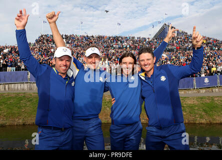 Team Europe's (left-right) Paul Casey, Ian Poulter, Tommy Fleetwood and Justin Rose celebrate after the Singles match on day three of the Ryder Cup at Le Golf National, Saint-Quentin-en-Yvelines, Paris. Stock Photo