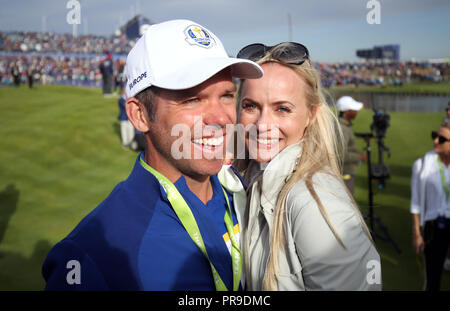 Team Europe's Paul Casey (left) and girlfriend Pollyanna Woodward celebrate after Europe win the Ryder Cup during the Singles match on day three of the Ryder Cup at Le Golf National, Saint-Quentin-en-Yvelines, Paris. Stock Photo