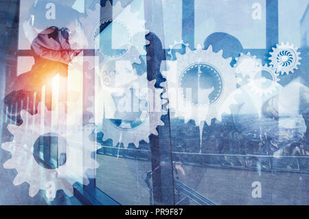 Business team with gears system. Teamwork, partnership and integration concept. double exposure Stock Photo