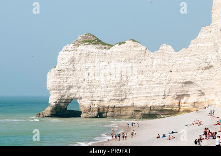 The white chalk cliffs of Etretat, France with sweeping pebble beach and natural arches, a beautiful seaside town in upper Normandy for a day trip Stock Photo