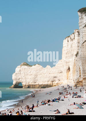 The white chalk cliffs of Etretat, France with sweeping pebble beach and natural arches, a beautiful seaside town in upper Normandy for a day trip Stock Photo