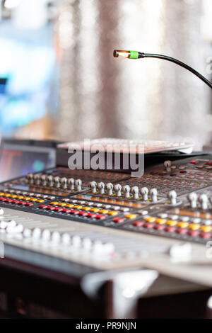 Mixing console of light equipment operator at the concert. Sound recording studio mixing desk with engineer or music producer Stock Photo