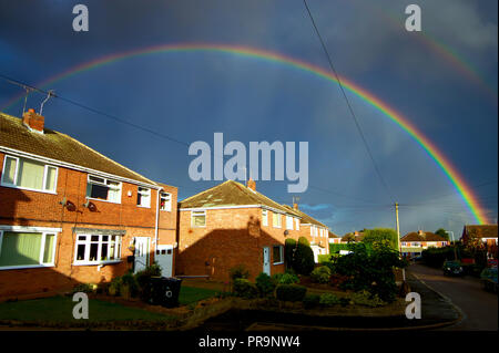 Double Rainbow over houses Stock Photo
