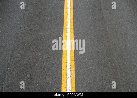 white line on asphalt road - two lane street Stock Photo