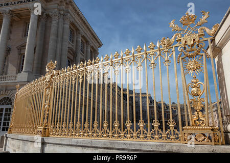 Golden fence in exterior facade of Versailles Palace, Paris, France Stock Photo