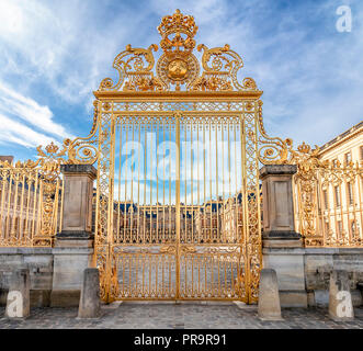 Main golden door in exterior facade of Versailles Palace, Paris, France Stock Photo