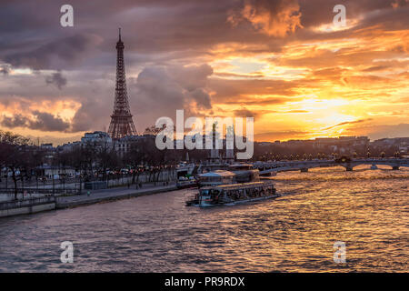 Amazing sunset in Paris, with Seine river, Pont Alexandre III and Eiffel tower Stock Photo