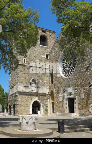 Front entrance and tower of Cathedral of Saint Justus (Basilica cattedrale di San Giusto Martire) in Trieste, Italy. Stock Photo