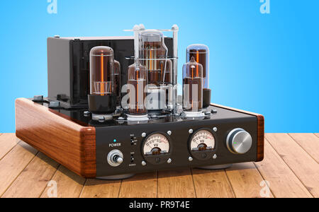 Vintage vacuum tube amplifier on the wooden table. 3D rendering Stock Photo